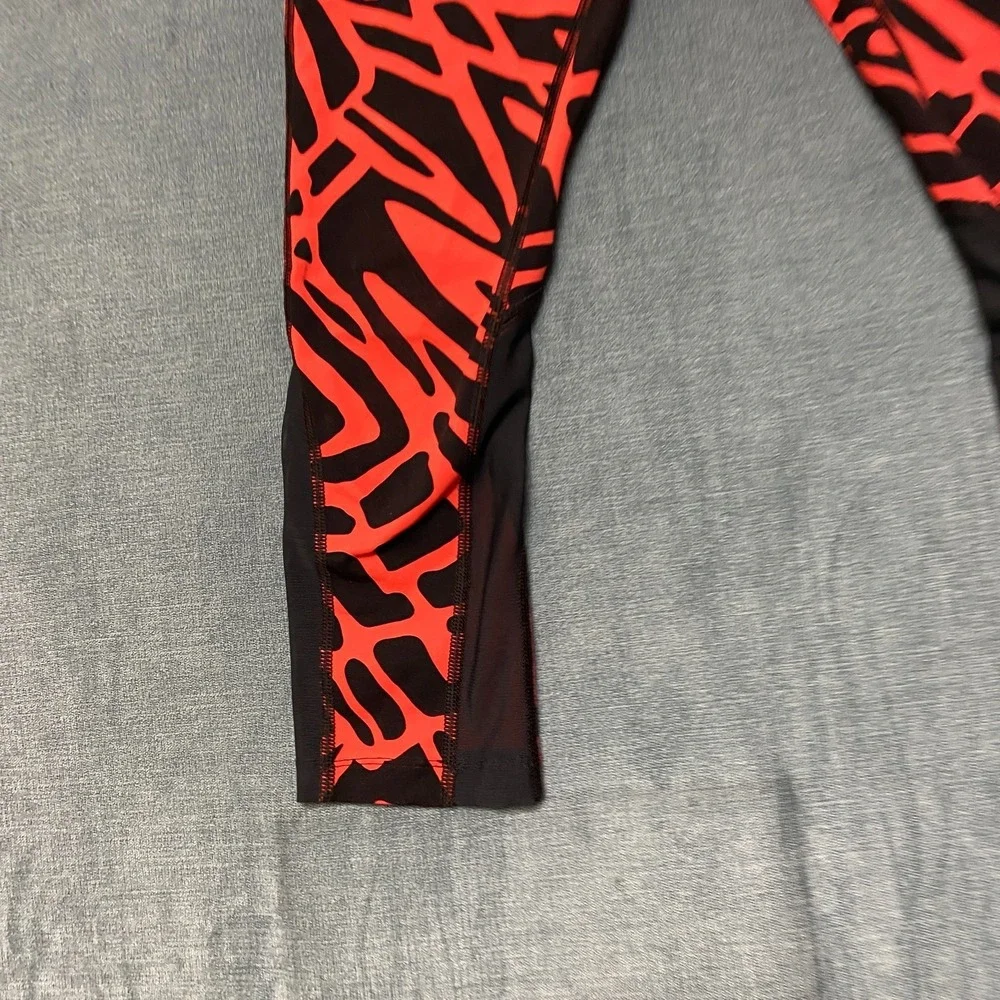 Nike Dri Fit Power Epic Lux Capri Leggings Womens XS Black Orange Abstract Print